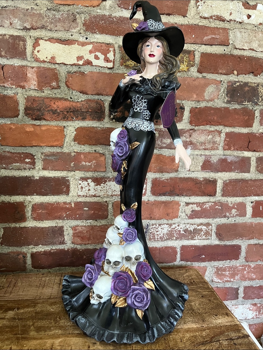 Elegant Black Witch Figurine with Purple Roses and Skulls - Home Accent